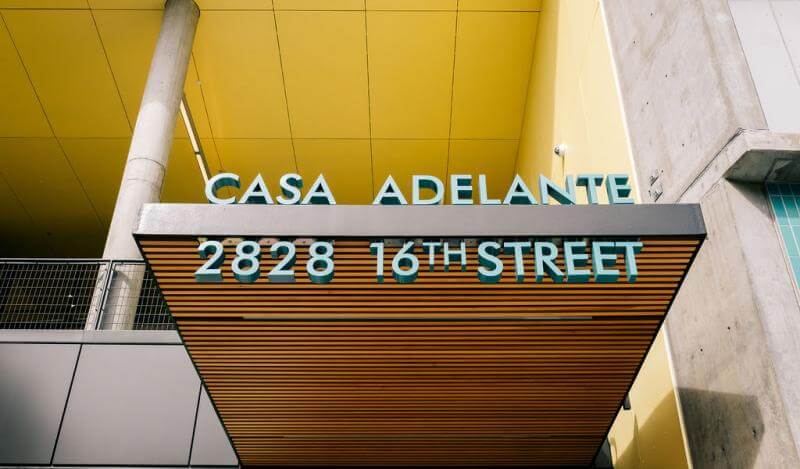building signage reading Casa Adelante 2828 16th Street