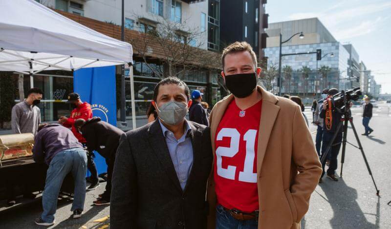 Maurilio Leon wears a mask next to Supervisor Haney in a mask
