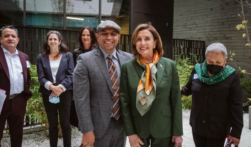 Maurilio Leon smiles next to Speaker Nancy Pelosi
