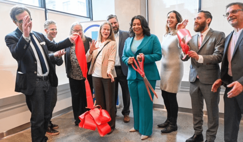180 Jones ribbon cut