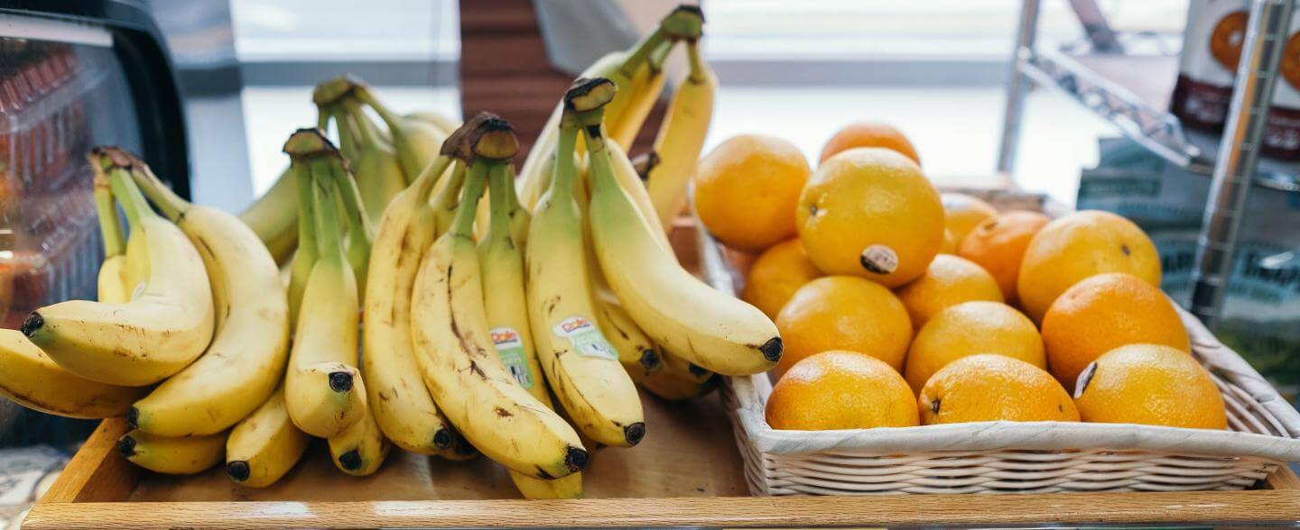 Store display of bananas and oranges