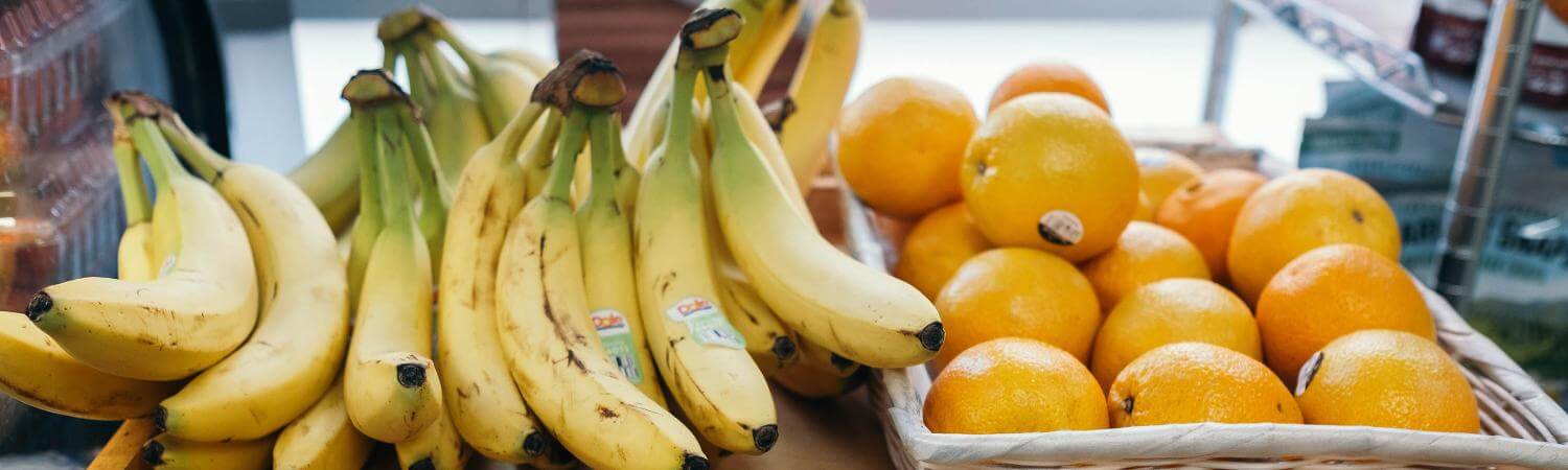 Store display of bananas and oranges