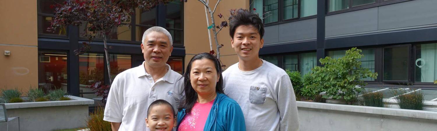 Four people standing in a courtyard