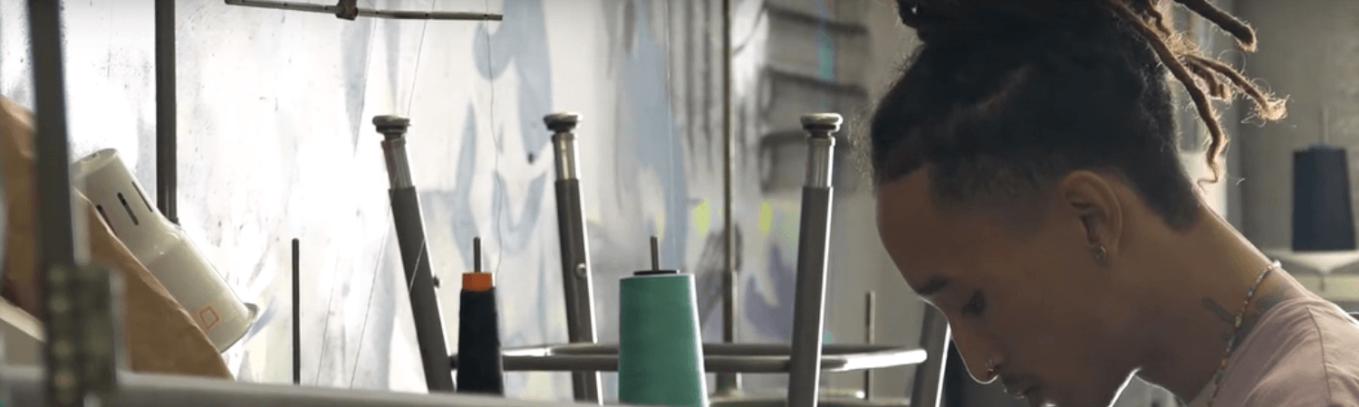 Julian Prince Dash at his sewing machine