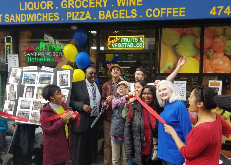 people in front of corner store