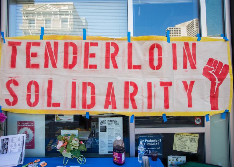 A handmade sign reads "Tenderloin Solidarity"