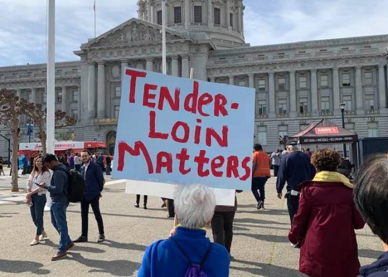 A sign reads "Tenderloin Matters" in front of SF City Hall