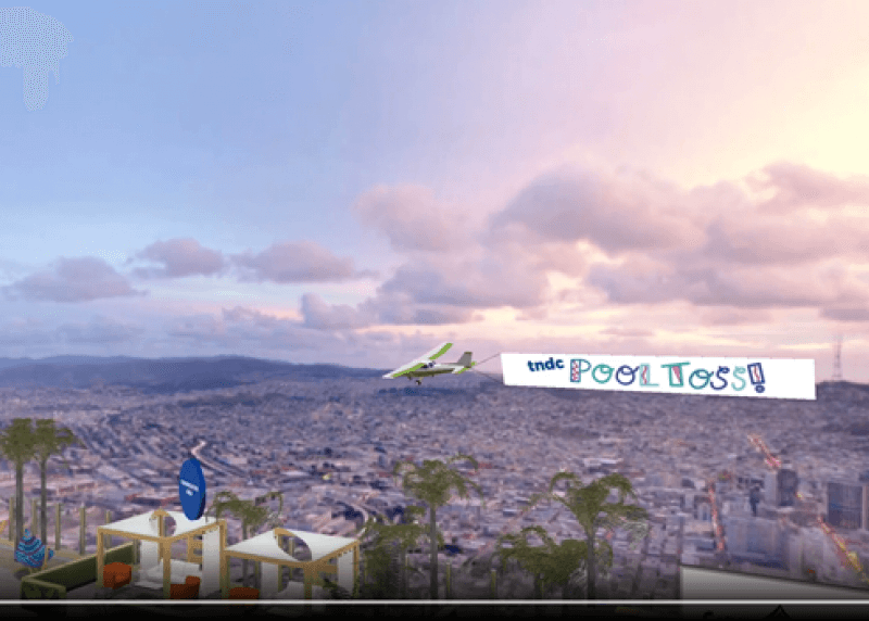 A digital image of San Francisco with a plane banner reading "TNDC Pool Toss"