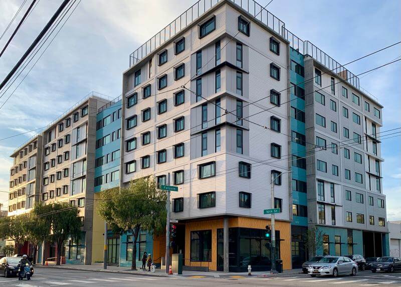 exterior of the building 2828 16th street, light blue and white walls dotted with windows