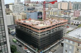 aerial view of 555 Larkin, a multi-storied building under construction