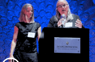 Roxanne Huey and Katie Lamont accept award at Curry Center. 
