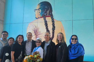 MEDA SF and TNDC officials gathered to celebrate mural unveiling at Casa Adelante. 